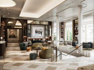 stone and white chequered floor, columns and a coffered ceiling with art on the wall in hotel lobby of Rosewood Munich