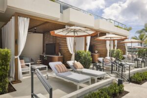 parasols and private cabanas around the pool