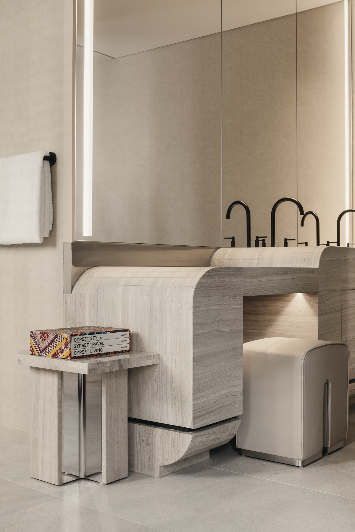 curved stone surfaces and vanity in bathroom of The Mondrian Shophouse Suite