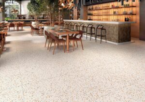 brown mottled floor tiles in a restaurant with wooden tables and chairs