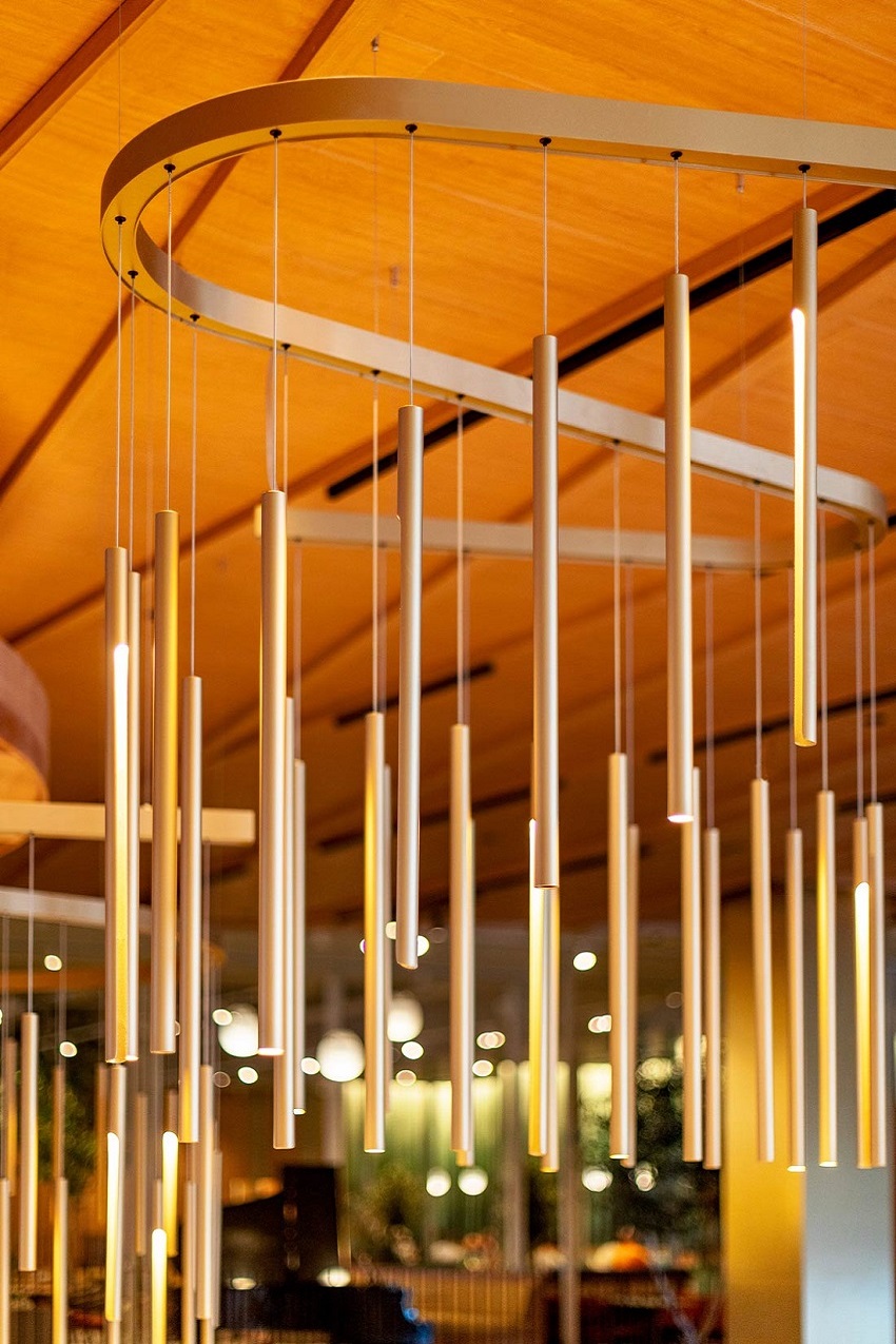 detail of wave like structure of lighting installation with suspended rods