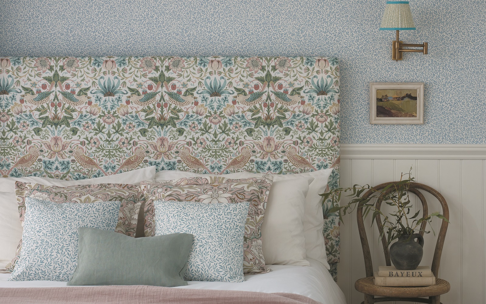 William-Morris Pink And Aqua details next to side chair by bed.