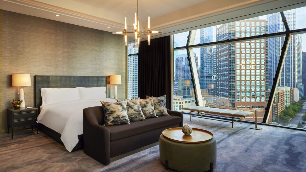 dramatic view over Chicago from floor-to-ceiling windows in the Presidential Suite St Regis Chicago