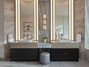 marble surfaces with double vanity and statement mirrors