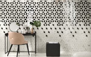 black and white geometric tile design on the wall behind a table and chair
