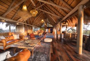 open sided lounge area with traditional thatched roof and wooden construction in the Okavango Delta