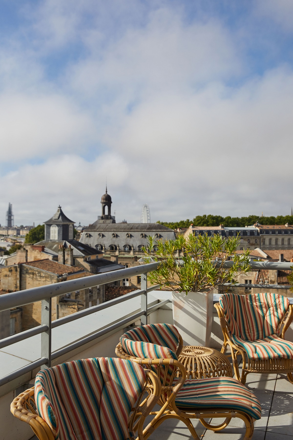 Hotel Indigo terrace over Bordeaux with wicker chairs