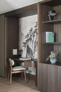 desk and shelving in clean lines with chair in front of japanese inspired print