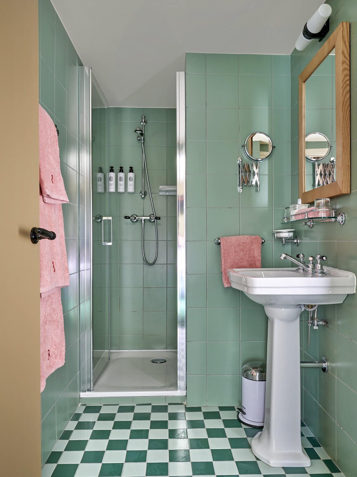 ensuite shower with white vintage style basin and green and white checked tiled floor