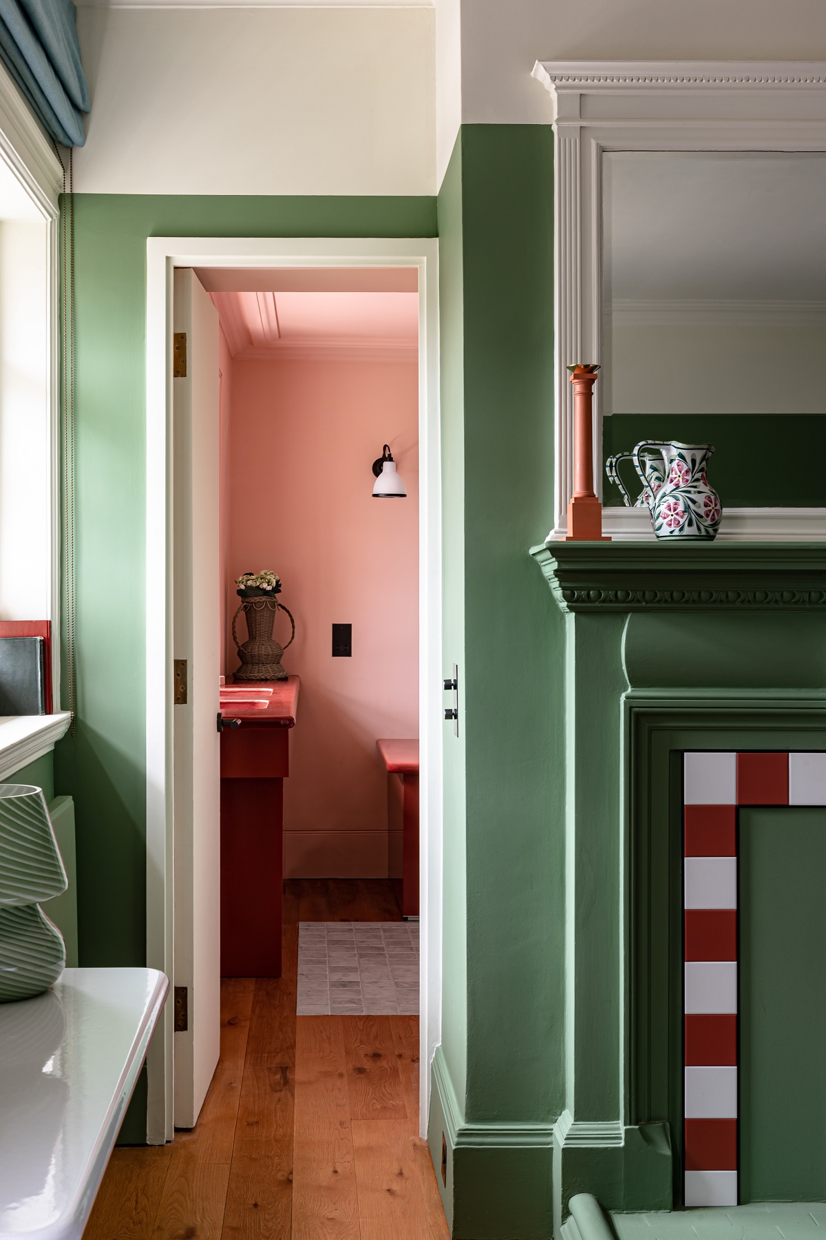 pink room through doorway from contrasting green room
