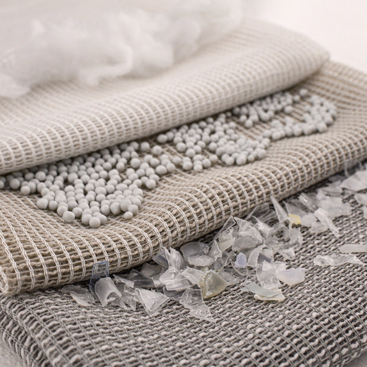 recycled fabric with plastic waste samples that are used in the yarn production