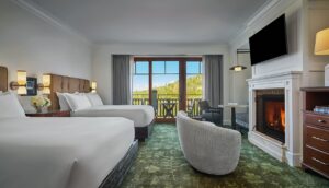 guestroom at Montage Deer Valley with green leaf design carpet and views across the mountains