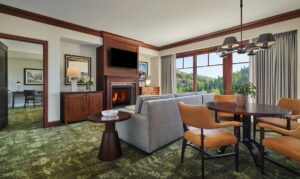green patterned carpet and wood details bring the outside in to the guestroom at Montage Deer Valley 