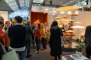 People and products at the woven design stand at 2023 Workspace Design Show in London
