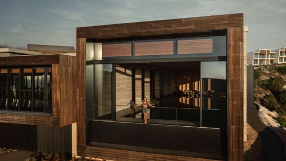 exterior view of terrace at Minthis Hills with square frame opening into guestroom