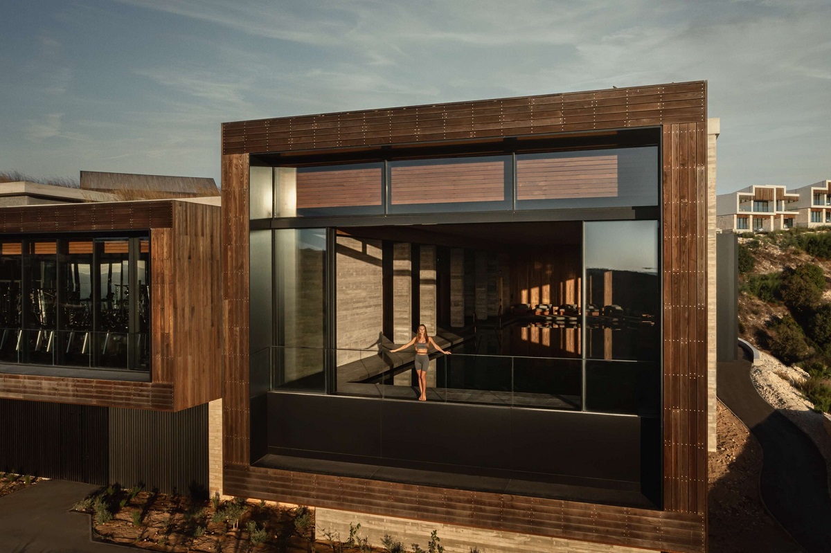 exterior view of terrace at Minthis Hills with square frame opening into guestroom