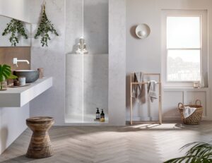 bathroom with white walls and surfaces and wooden herringbone parquet flooring and details