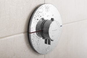 a chrome shower control with all the workings hidden behind the tiled surface