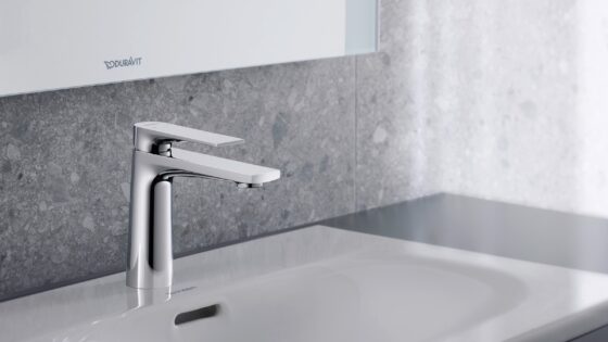 chrome tulum tap by Duravit over a white basin against grey stone surface