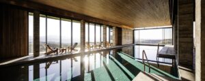 indoor swimming pool and spa with views across the cypriot mountains