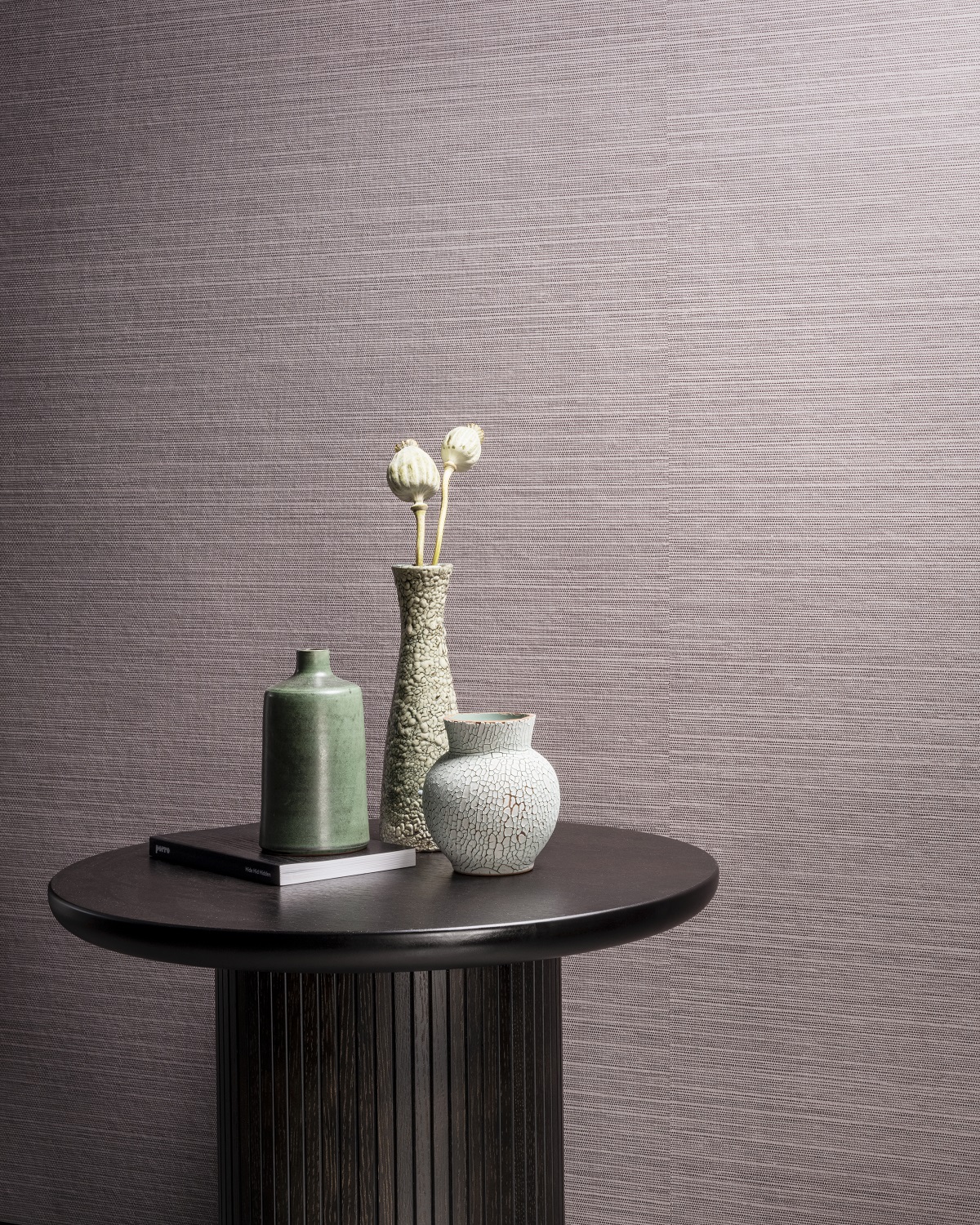 lavender grey textured wallcovering from Arte with table and ceramic vase with white flower