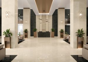 lobby and entrance with plants and tiled surfaces in large format cream tiles with darker details on the edges