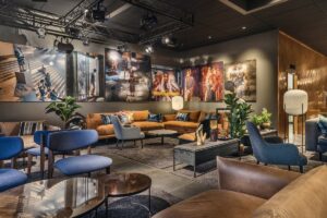 public seating space with film references and blue and orange colour notes in Hotel Draak