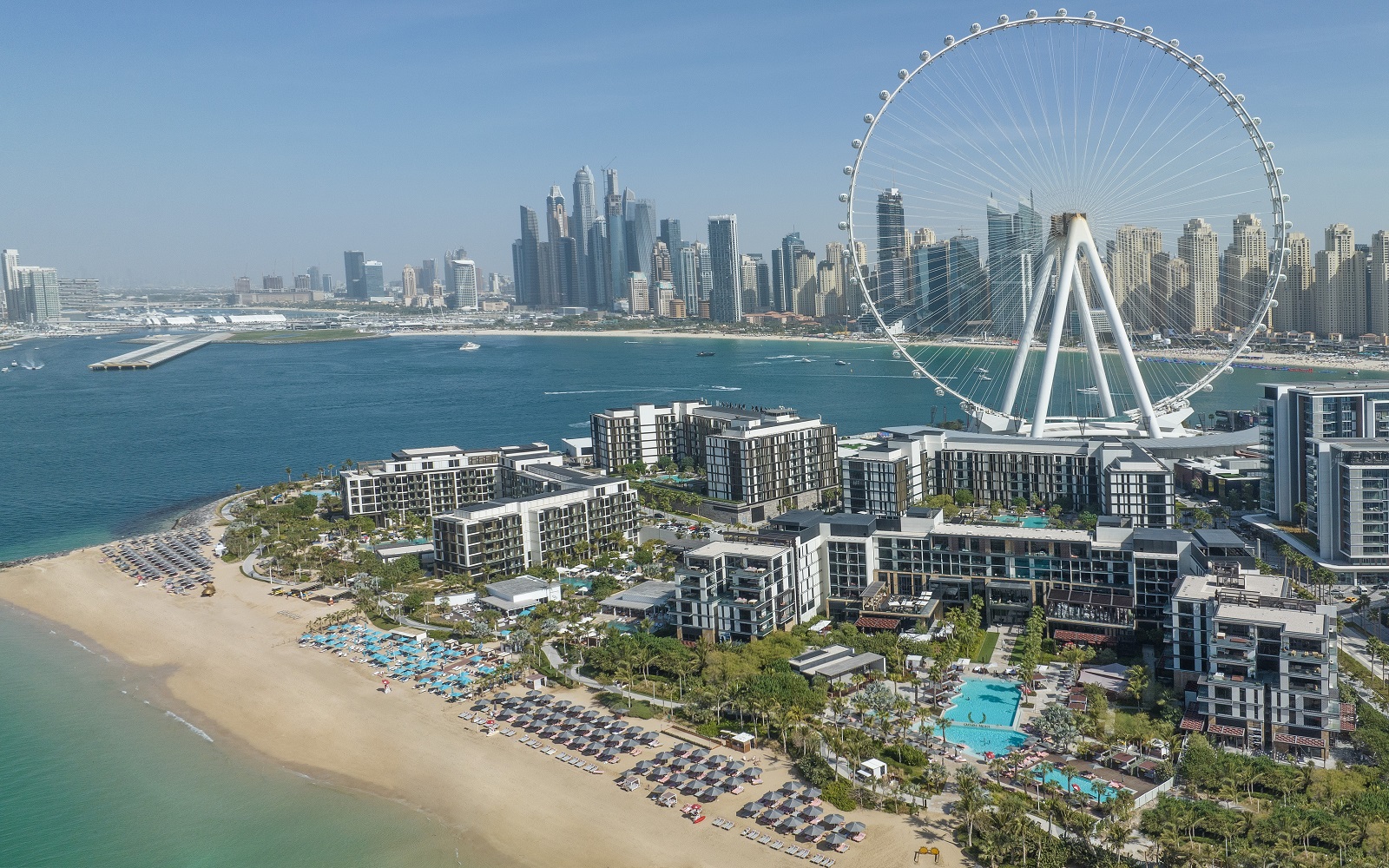 aerial view across dubai with Bluewaters development in foreground