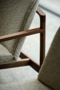 detail of wooden from of upholstered chair