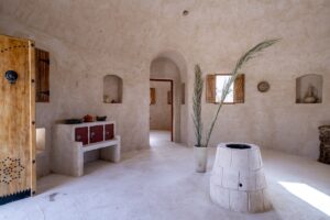 adobe style interior of traditional tunisian building at hotel showing local sustainable farming practices