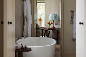 contemporary white freestanding bath in en-suite bathroom of country hotel Grove at Narberth