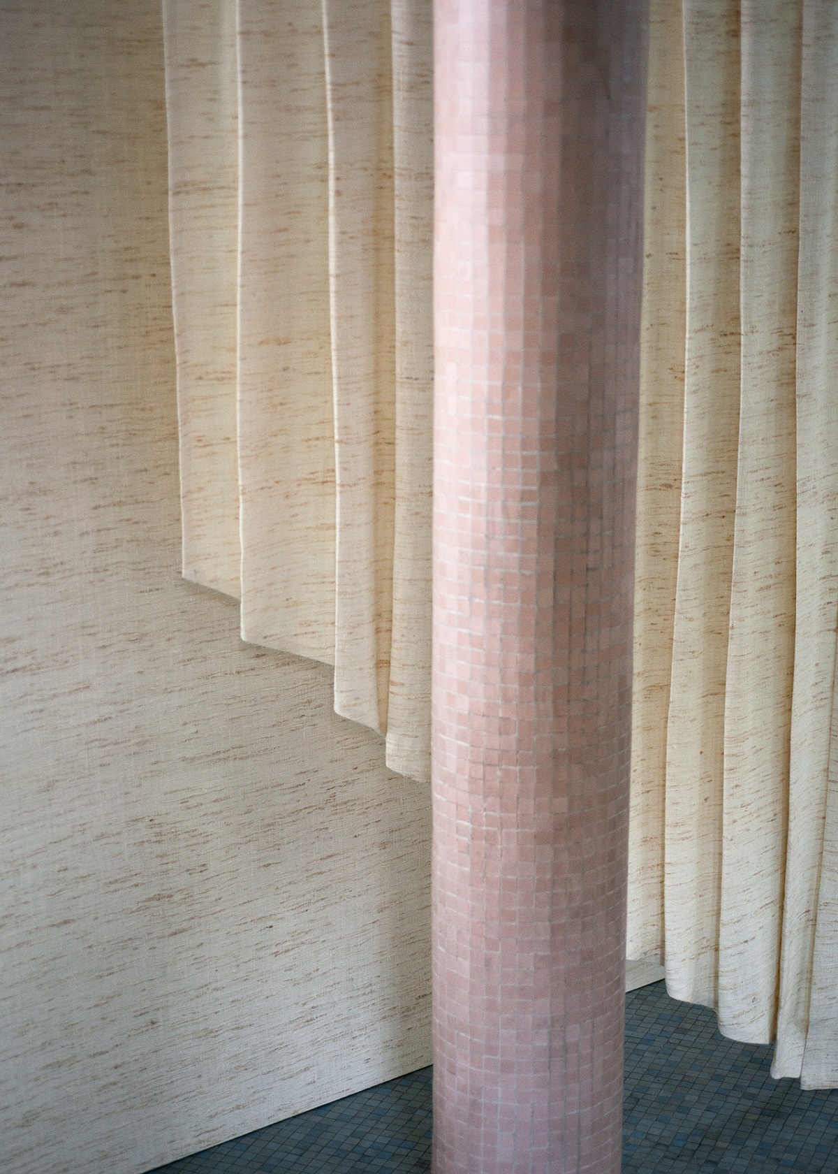 pink mosaic column, blue floor and Dedar Chatwin silk fabric and wall covering