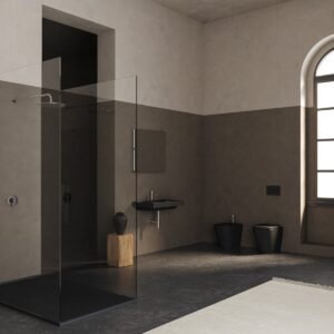 minimalist bathroom with glass shower and brown and cream wall with black fittings from Laufen Meda range