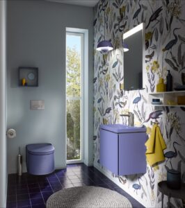 lavender grey coloured toilet and basin from Duravit against bold botanical wallpaper