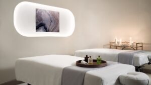 candlelight and backlit agate on the wall create treatment room ambiance