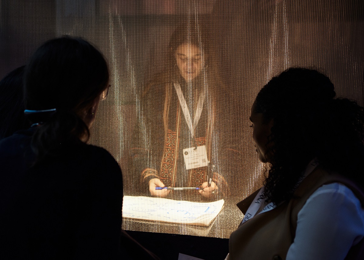 the confession booth at HIX with metal screen between artist and people on the other side of the mesh