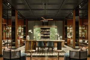 central wooden bar with asian design references in Regent Phu Quoc