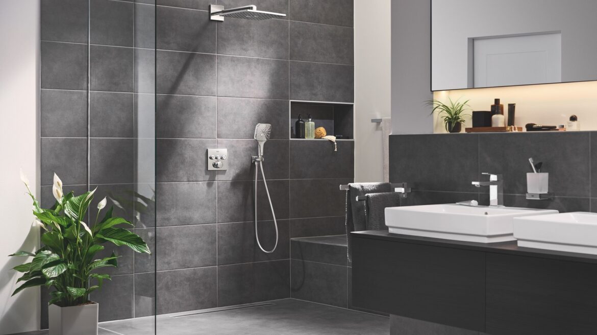black and slate grey bathroom with glass shower with concealed unit by GROHE