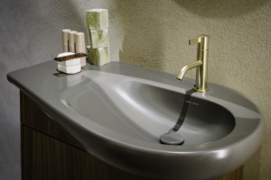 grey basin with gold taps
