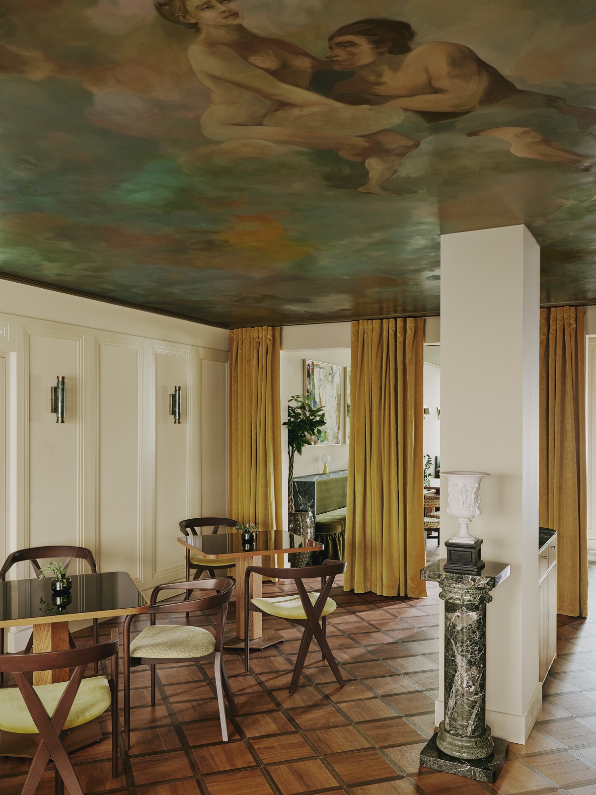 ceiling with a fresco mustard curtains dividing spaces and dining tables