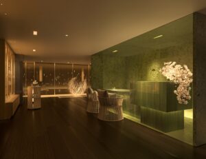 green marble reception desk and wall in the spa at Mandarin Oriental