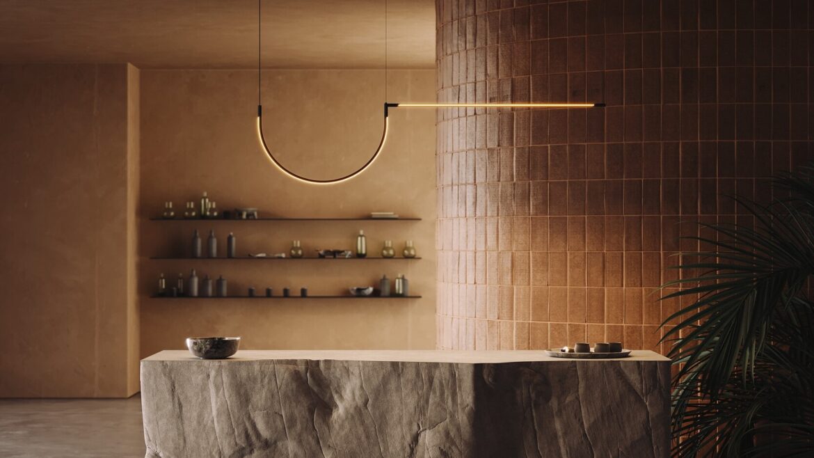 stone counter in front of brown tiled wall with architectural tubular lighting above from LedsC4