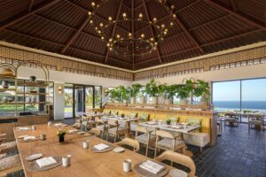 restaurant with wooden table and chairs and balinese style architecture and design