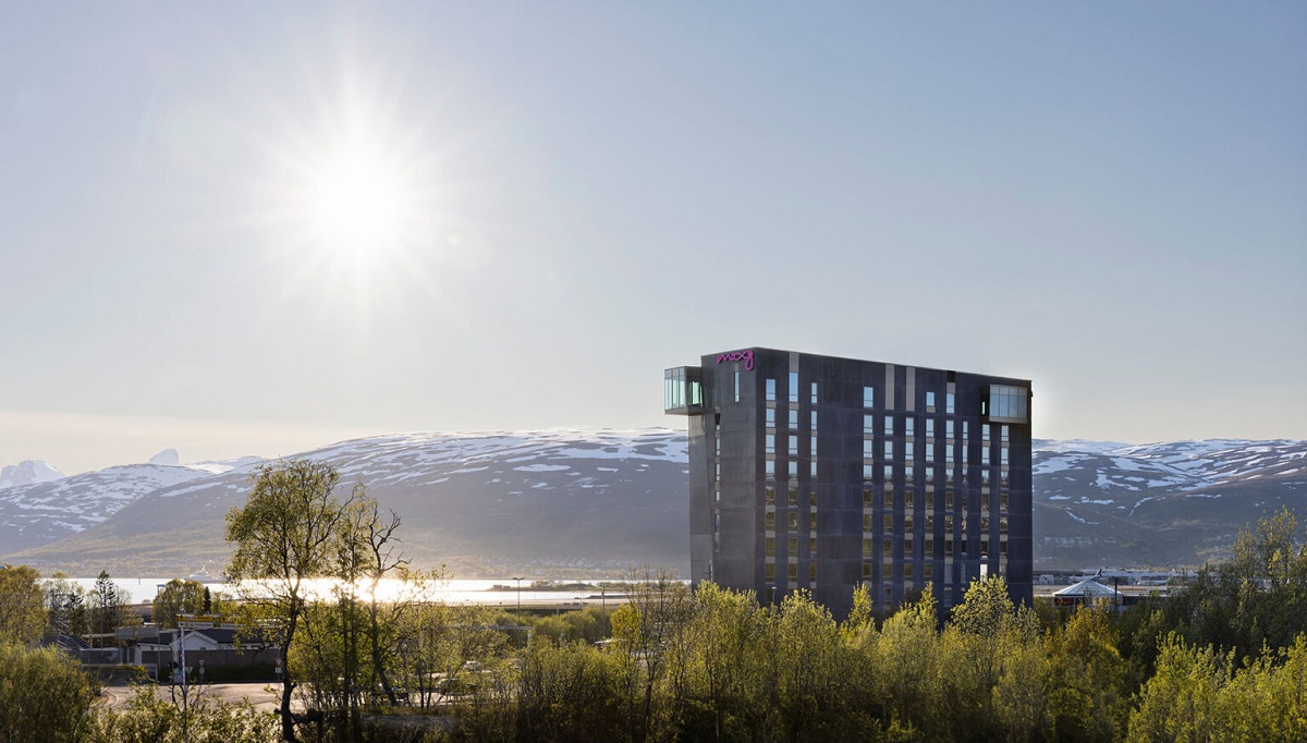 Exterior image of Moxy Tromso, in between natural vistas and fjrods and mountains