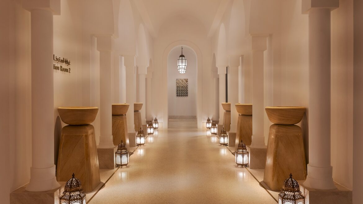 columns and candlelight leading into the spa at The St Regis Tamuda Bay