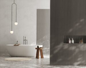 grey oak veneer wall panels from Havwoods in bathroom with white freestanding bath and wooden stool alongside