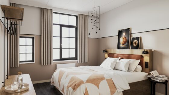 guestroom in Bob W Osterbro with walls in taupe and white and patterned throw on bed