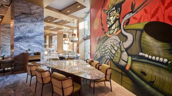 bold wall mural behind marble table and seating in JW Marriott Hotel Mexico City Polanco