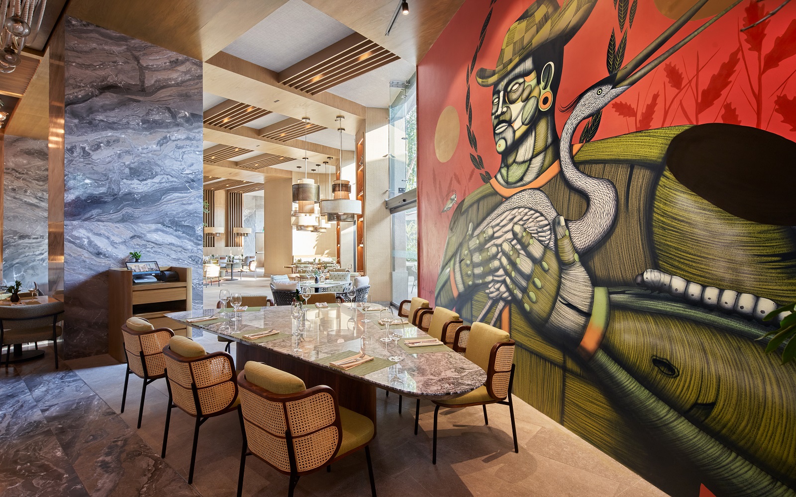 bold wall mural behind marble table and seating in JW Marriott Hotel Mexico City Polanco
