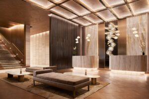 architectural lighting and minimalist marble with seating in the entrance to JW Marriott Mexico city